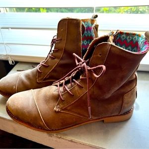 Women’s size 12- Toms brown leather lace up boots with side zipper.